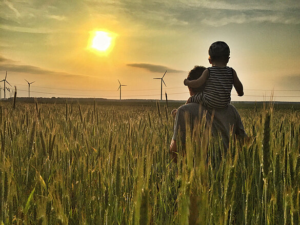 Sunset, wheat field, father with child, sustainable, Windmill
